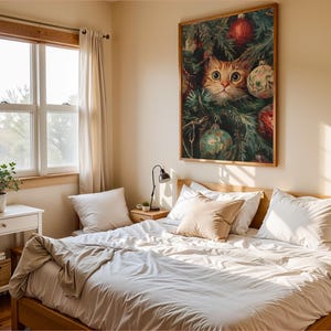 May include: A bedroom with a wooden bed frame, white bedding, and a large framed print of a cat peering through Christmas tree branches. The room has a window with natural light and a small side table.
