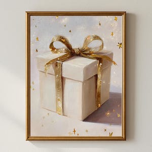 May include: A framed painting of a white gift box tied with a gold ribbon. The box is centered, with a gold bow on top. Gold stars are scattered around the box against a light background. The painting is in a gold frame.