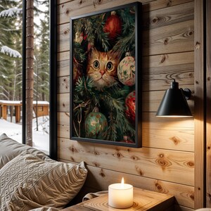 May include: A framed print featuring a cat peering through Christmas tree branches adorned with ornaments. The cat has orange and white fur and large, expressive eyes. The print is displayed on a wooden wall, with a lit candle and a window overlooking a snowy forest.
