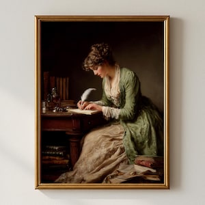 May include: A framed print of a woman writing with a quill pen at a desk. The woman is wearing a green dress with lace trim. Books and a bottle are on the desk. The frame is gold.