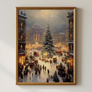 May include: A framed painting depicts a snowy Christmas scene in a European town square. A large decorated Christmas tree stands in the center, surrounded by horse-drawn carriages, buildings, and people. The artwork is in a gold frame.