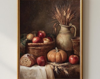 May include: A framed still life painting featuring a basket of apples, a pumpkin, and a loaf of bread. A ceramic pitcher holds wheat stalks. The color palette includes warm tones of red, orange, and brown, creating a rustic, autumnal theme.