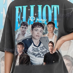 Peut inclure: T-shirt gris foncé Comfort Colors avec un collage d'images d'Elliot Page. Le t-shirt porte le nom "Elliot Page" dans une police bleue rétro. Le t-shirt porte également le texte "Cheap Thrills" sur le devant.