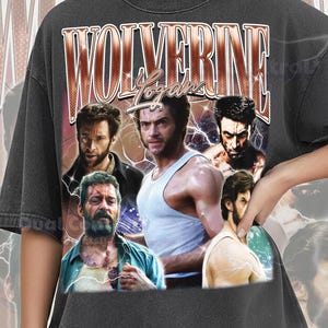 May include: A charcoal grey t-shirt featuring a graphic print of the character Wolverine from the X-Men series. The design includes the text "WOLVERINE" in large letters and "Logan" in script, with multiple images of the character.