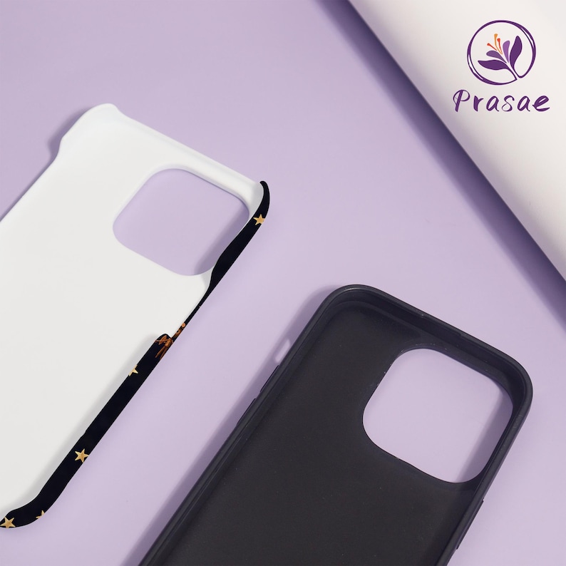 May include: Two phone cases, one white and one black, are shown against a purple background. The white case has a black border with gold stars. The black case is plain. The brand name "Prasae" is visible in the upper right corner.