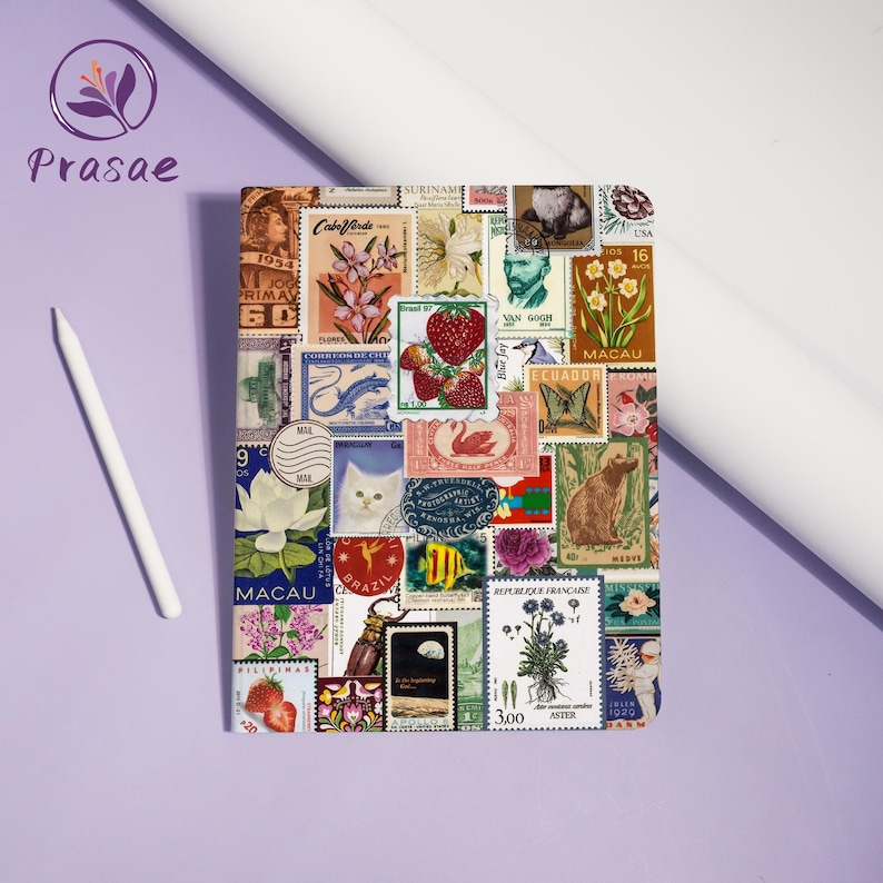May include: A square, multi-colored tablet case covered in a collage of vintage postage stamps. The stamps feature images of flowers, animals, and portraits. A white stylus pen rests on the left side of the case.