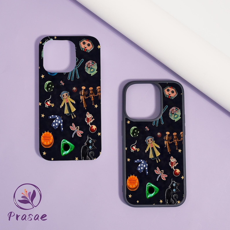May include: Two black phone cases featuring a repeating pattern of cartoon characters, stars, and other whimsical elements. The cases have a dark background and a protective border.