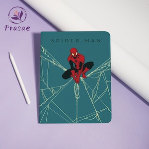 May include: A teal notebook featuring Spider-Man. The cover displays the words "SPIDER-MAN" above an illustration of the superhero in a crouching pose, with a web design. A white stylus is on the left.