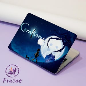 May include: A laptop skin featuring a dark blue night scene with a large full moon, a silhouette of a house, a small figure in a yellow coat, and a black cat. The text Coraline is printed in a light blue script font across the top left corner.