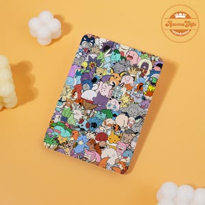 May include: A rectangular, multi-colored case featuring a collage of cartoon characters. The case has a vibrant design with various characters in different colors. The case is set against a light orange background.