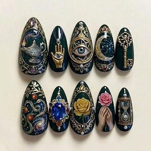 May include: A set of ten dark green, almond-shaped artificial nails with intricate, ornate designs. Each nail features a unique, detailed embellishment, including a genie lamp, an eye, a key, a rose, and a hand holding a rose.