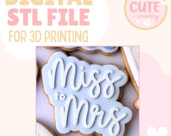 May include: A light pink background with the text "DIGITAL STL FILE FOR 3D PRINTING". A close-up of a cookie with blue icing and the words "Miss to Mrs" in white script. A logo for "Cute + crumbly" is in the upper right corner.