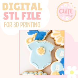 May include: Digital STL file for 3D printing. The image shows baby-themed biscuits, including a light blue onesie biscuit with a yellow flower, and round biscuits with the letter "B". Other biscuits include a blue bow and a yellow flower.