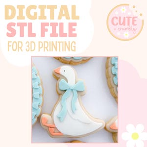 May include: A decorated cookie shaped like a white goose with a light blue bow. The cookie has a light brown outline and peach-coloured feet and beak. The text "DIGITAL STL FILE FOR 3D PRINTING" is at the top.