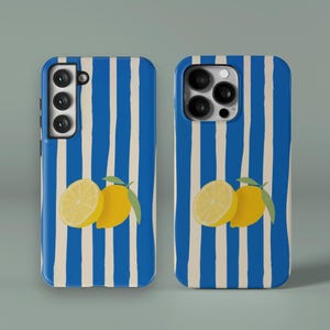 May include: Two phone cases with a blue and white striped design. Each case features a yellow lemon illustration with green leaves. One lemon is sliced in half. The cases are designed for different phone models.