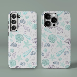 May include: Two phone cases with a white background and a repeating pattern of seashells, starfish, and sand dollars in shades of blue, teal, and purple. The cases are for different phone models.