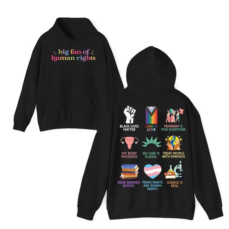 May include: Black hoodie with the text "big fan of: human rights" in colorful letters. The back of the hoodie features various graphics and phrases, including "Black Lives Matter" and "Love is Love."