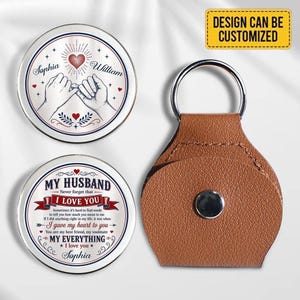May include: Two circular metal tokens and a brown leather keychain with a silver ring. One token features a pink heart, two hands pinky promising, and the names Sophia and William. The other token displays the text MY HUSBAND NEVER FORGET THAT I LOVE YOU.
