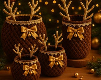 May include: Four brown decorative containers with gold reindeer antlers, bows, and trim. The containers are displayed on a wooden surface with Christmas ornaments and greenery in the background. The containers are of varying sizes and shapes.