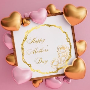 May include: A white card with a gold frame and the text "Happy Mother's Day" surrounded by gold hearts and a gold floral design. The card is surrounded by pink and gold heart-shaped decorations.
