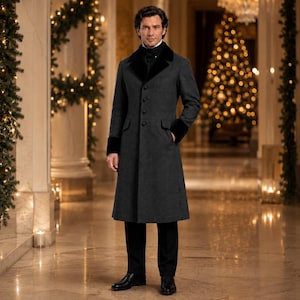 May include: A charcoal gray long coat featuring a black velvet collar and matching black velvet cuffs. The coat has a structured fit with a single-breasted front closure, four visible buttons, and long sleeves, paired with black trousers and shoes.