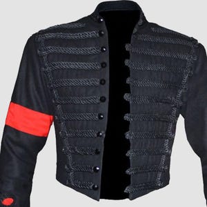 Michael Jackson black military jacket inspired by MTV Awards, featuring gold embellishments on black wool fabric.