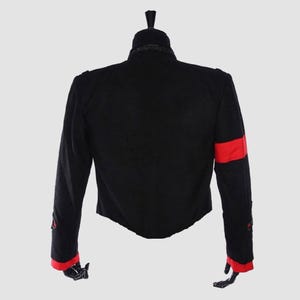 Michael Jackson tribute jacket in black wool with structured shoulders and clean military-style design