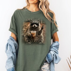 Funny animal raccoon holding iced coffee stylish shirt design