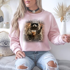 Cute raccoon coffee lover illustration with sunglasses and drink