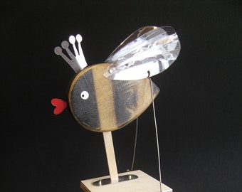 Be kind to the bees Automata. Finished in bare wood and black paint.