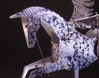 Pegasus Automata in aluminum stamped in blue.