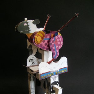 Kit of automata cut out of the Skiing Sheep card.