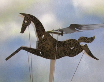 Black and gold Pegasus automata with black base