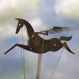 Black and gold Pegasus automata with black base image 1