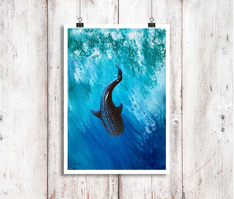 May include: A black and white whale shark swims in a blue and green ocean. The shark is facing upwards with its mouth open. The water is painted with white and blue swirls.