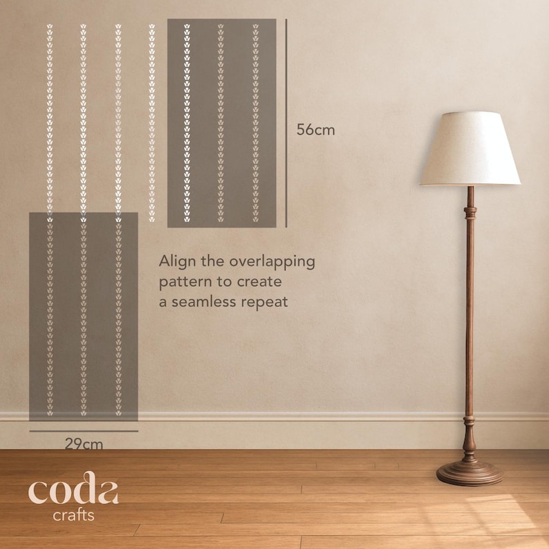 May include: A sample of wallpaper, 29cm wide and 56cm high, with a repeating pattern of white floral designs on a gray background. The text "Align the overlapping pattern to create a seamless repeat" is visible. A floor lamp is in the background.