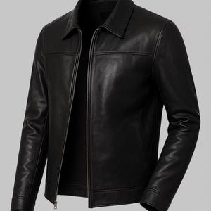 May include: A black leather jacket with a collared neckline and a full-length zipper. The jacket has a classic design with a tailored fit, featuring a pocket on each side. The leather appears smooth and has a slight sheen.