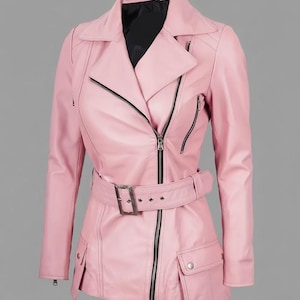 May include: A pink leather jacket with a notched collar, asymmetrical zipper closure, and a belted waist. The jacket features black zippers, two front pockets, and a black lining. The jacket's length is approximately 30 inches.