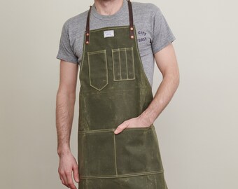 Delantal de carpintería con correa en Y de cuero en lienzo encerado de oliva / ARTIFACT