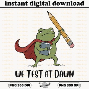 May include: A digital download graphic featuring a cartoon frog in a red cape, holding a book and a large pencil. The frog has a serious expression. The text "WE TEST AT DAWN" is below the frog. The words "instant digital download" are at the top.
