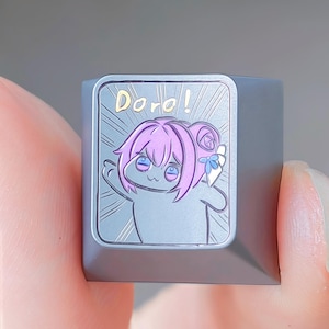 Doro Girl Expression Keycap – Hand Engraved Titanium 1u Cap – Funny Anime Artisan Key for Mechanical Keyboard