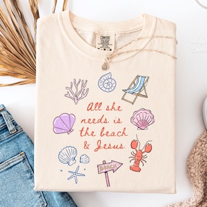 All she needs is Jesus and the beach comfort colors lobster shirt, minimalist beach tshirt, summer aesthetic shellfish shirt
