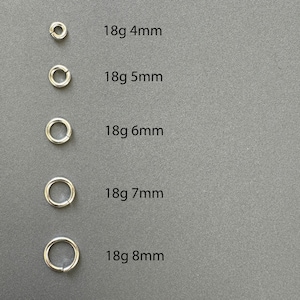 May include: Five silver jump rings in different sizes, labeled 18g 4mm, 18g 5mm, 18g 6mm, 18g 7mm, and 18g 8mm.
