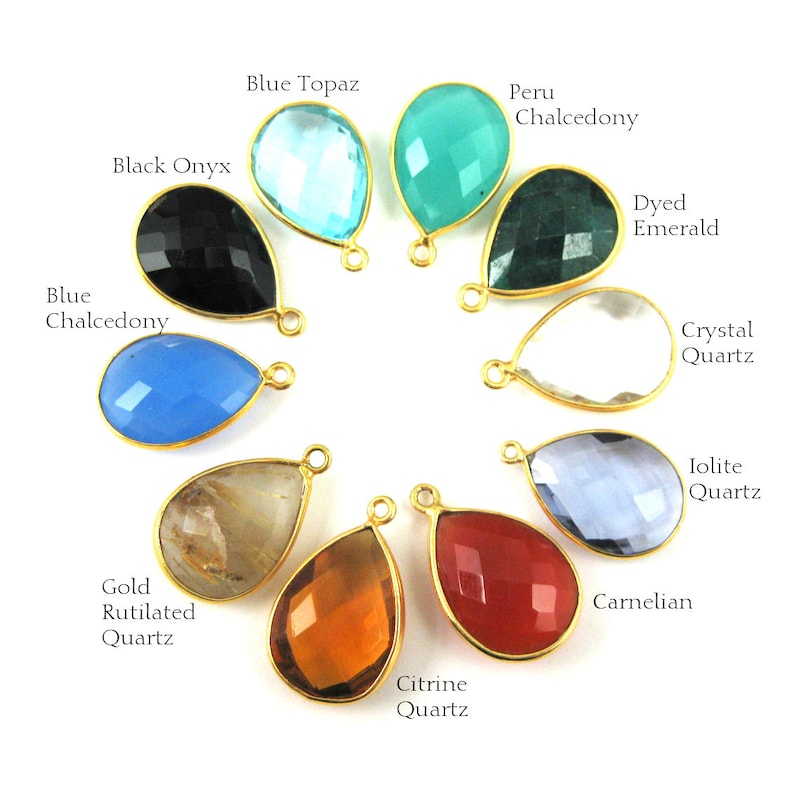 different bezel teardrop pendants are displayed in a circle with their name next to them.10