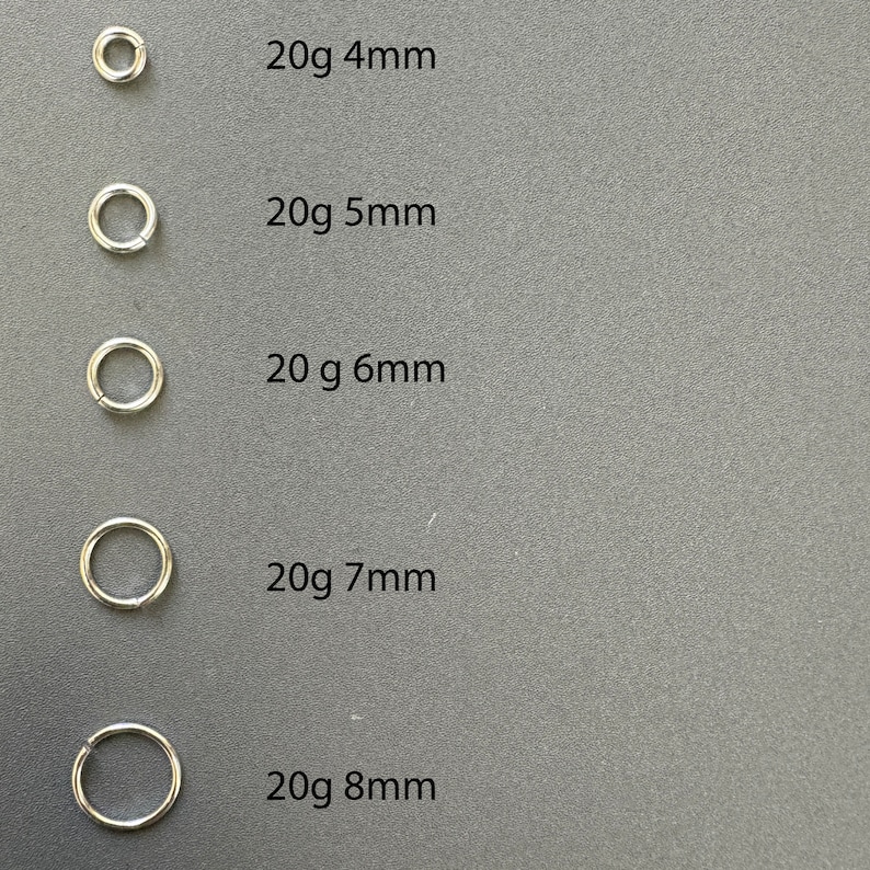 May include: Five silver hoop earrings of different sizes, labeled 20g 4mm, 20g 5mm, 20g 6mm, 20g 7mm, and 20g 8mm.