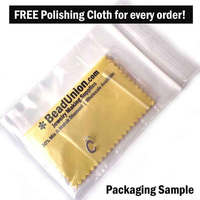 May include: A close-up of a small silver charm in the shape of the letter "C" inside a clear plastic bag with a yellow polishing cloth. The bag has a white zipper and the text "BeadUnion.com Jewelry Making Supplies 30% Mix & Match Discount | Wholesale Available" is printed on the cloth. The text "Packaging Sample" is printed below the bag.