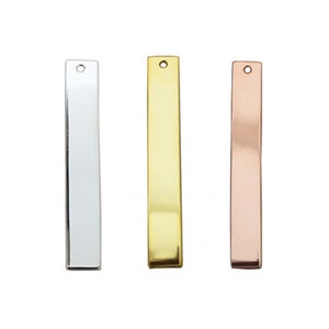 May include: Three metal bar pendants in silver, gold, and rose gold. Each bar has a small hole at the top for attaching a chain or string.