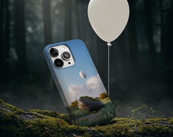May include: A blue iPhone case with a white balloon and the text "let it go" printed on it. The case is sitting on a mossy log with a white balloon floating above it.