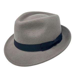 May include: A grey fedora hat with a black ribbon and bow.