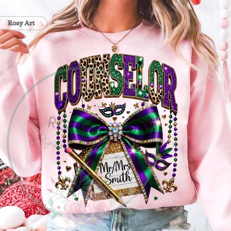 May include: Pink sweatshirt with a colorful Counselor design. The design features the word "COUNSELOR" in green, purple, and leopard print, with a large bow and pencil. The design also includes a note that says "Mr/Mrs Smith".